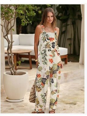 Adorable Cream Floral Wide-Leg Jumpsuit with Adjustable Straps.